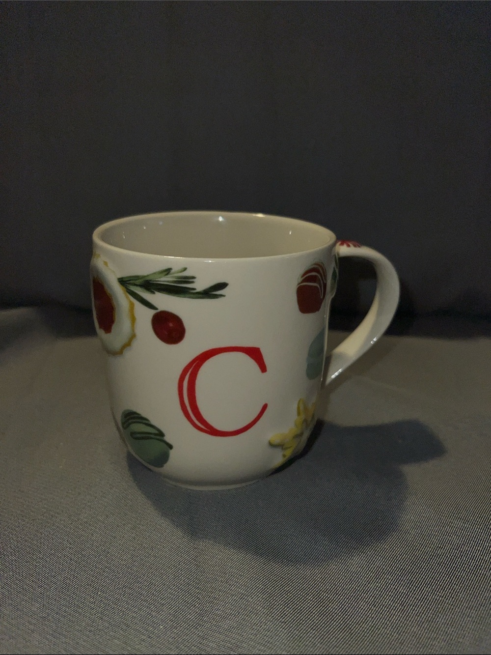 Anthropologie White Mug with Yellow Snowflake and Red Candy Accents